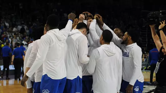 Team Huddle Before Taking on Kansas
