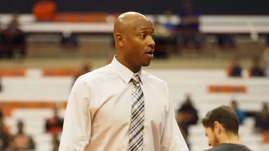 Duane Woodward coaching with Monmouth at Syracuse