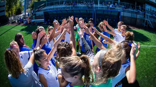 Women's Soccer Team Huddle Before Butler