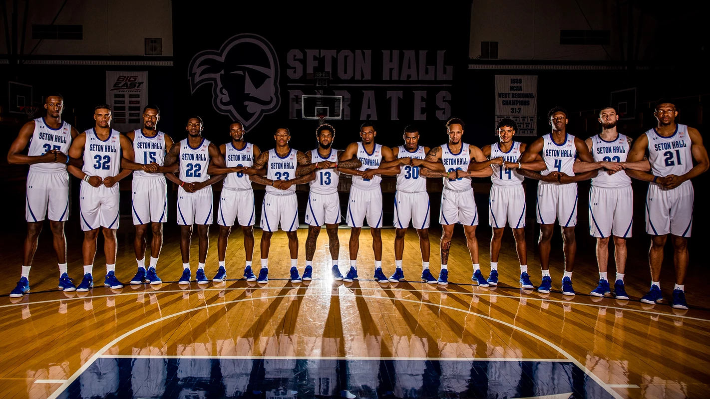 Men's Basketball Team Arms Locked Photo
