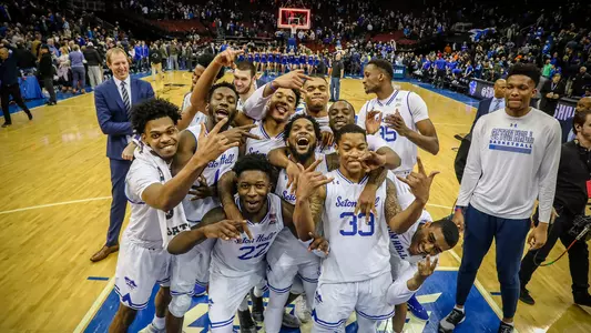 Men's Basketball Team Posing After Creighton Win