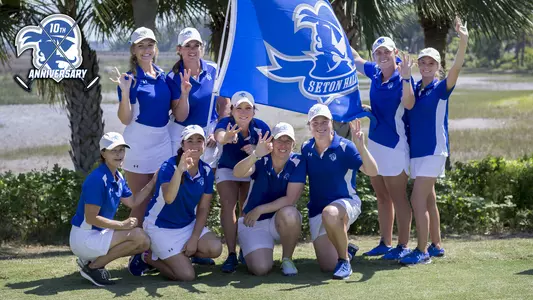 Members of the Seton Hall Women's golf team pose with the team flag after the final round of the Big East golf tournament in Okatie, S.C., Sunday, April 24, 2016. (Photo/Stephen B. Morton)