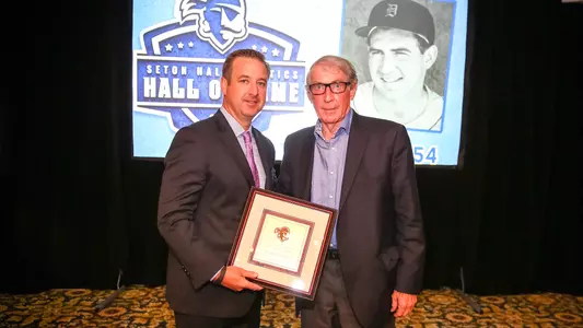 Tom Sharkey (right) accepting his Hall of Fame induction plaque from Pat Lyons