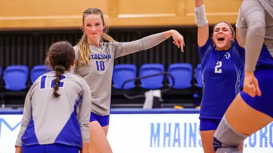 Jenna Walsh celebrates a point against UConn on Sept. 23.