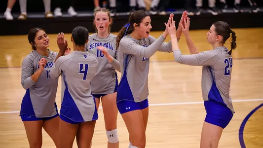 Seton Hall Women's Volleyball Team celebrate a point against UConn on Sept. 23.