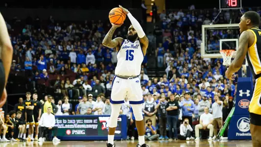 Jamir Harris shoots a three against Iowa