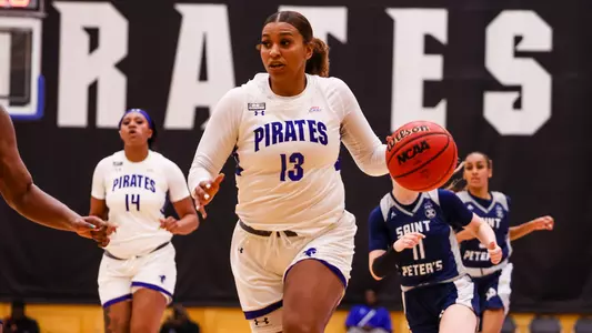 Kae Satterfield dribbles down the court against Saint Peter's on Nov. 7