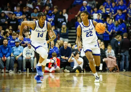 Tae and Dre Davis run up the floor against Drexel