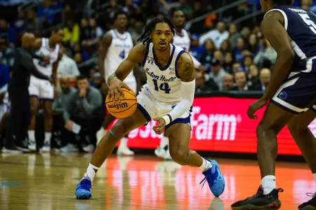 Dre Davis dribbling against Monmouth