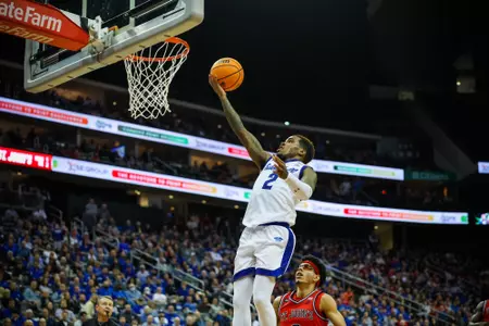 Al-Amir Dawes drives to the rim against St. John's