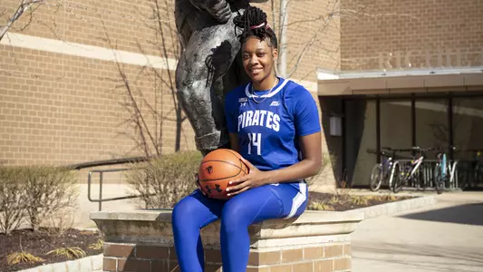 Jala Jordan sits on the Pirate statue outside of the Rec Center at Seton Hall