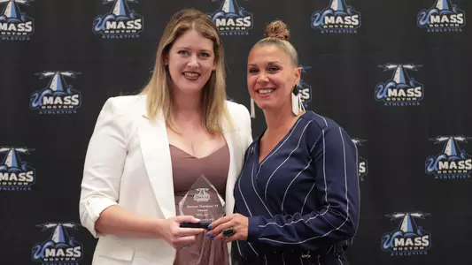 Shannon Thompson poses with her award after being inducted into the UMass Boston Hall of Fame