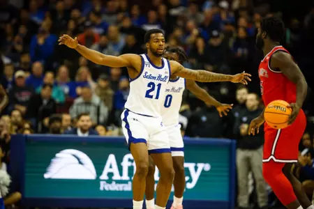 Femi Oduakle defends the ball against St. John's