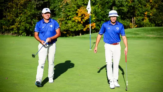 Wenliang Xie and Wanxi Sun come off the green during a practice round in the fall of 2023