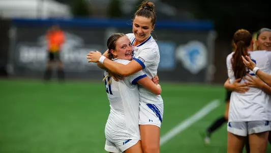 Natalie Tavana and Chiara Pucci celebrate after Tavana's third goal in the Pirates' win over Binghamton