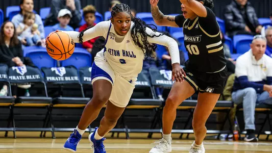 Micah Gray drives past a defender against Bryant on Nov. 12.