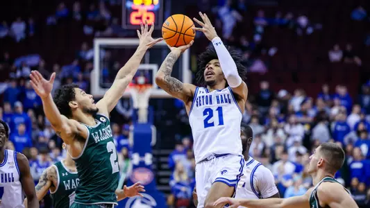 Isaiah Coleman puts a shot up against Wagner