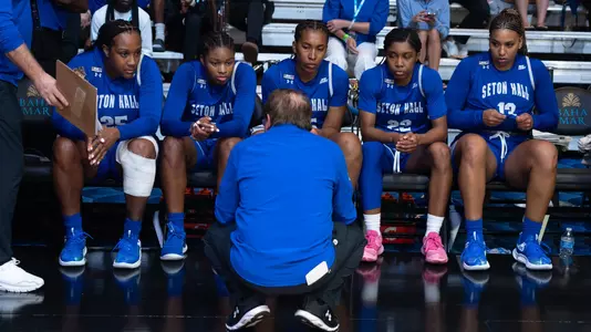 Coach Bozzella talks to the starting five prior to playing USC on Nov. 20.