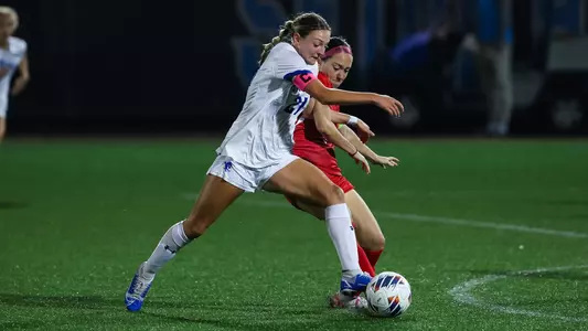 Natalie Tavana jockeys for position against St. John's