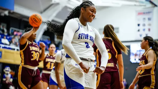 Micah Gray flexes after a score against Iona on Nov. 7
