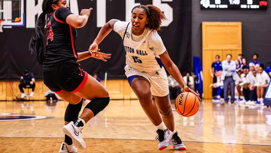 Azana Baines drives past her defender for a basket against UNLV on Dec. 16