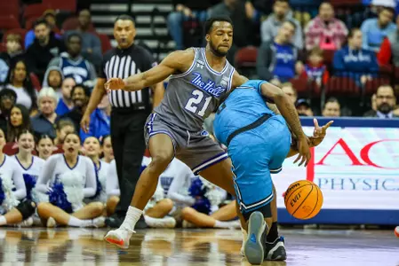 Femi Odukale drives to the basket against Georgetown