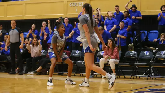 Lauren Park-Lane and Alexia Allesch celebrate during a game on Feb. 13 against DePaul