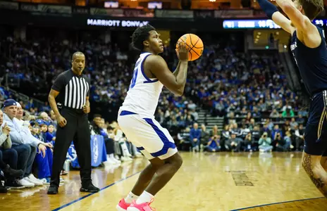 Jaquan Sanders take a three-pointer against Xavier