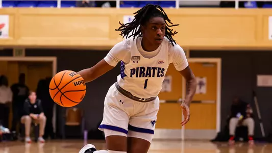 Sha'Lynn Hagans drives against Xavier on Feb. 18