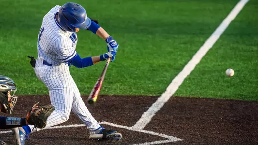 Zack Sylvester swings at a pitch against Monmouth on March 16