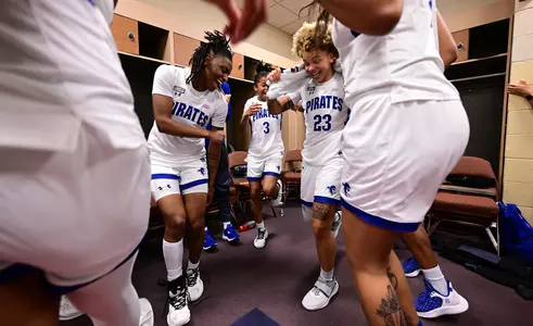 Victoria Keenan celebrates with Sha'Lynn Hagans in the locker room after Seton Hall's win over Xavier in the BIG EAST Tournament.