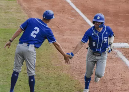 Max Viera rounding third after a home run against Houston Christian