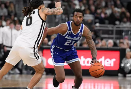 Mar 4, 2023; Providence, Rhode Island, USA; Seton Hall Pirates guard Femi Odukale (21) drives by Providence Friars guard Alyn Breed (0) during the second half at Amica Mutual Pavilion. Mandatory Credit: Eric Canha-USA TODAY Sports