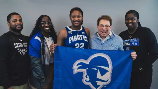 Micah Gray poses with her family and Seton Hall head coach Tony Bozzella at her official visit