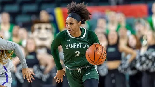 Brazil Harvey-Carr dribbles the ball while playing for Manhattan during the 2022-23 season.