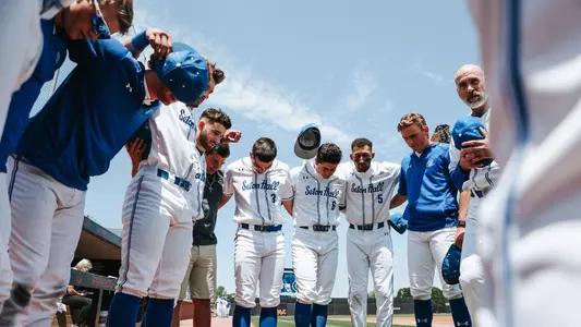 Head coach Rob Sheppard huddles with his team before playing Georgetown in the 2023 BIG EAST Championship