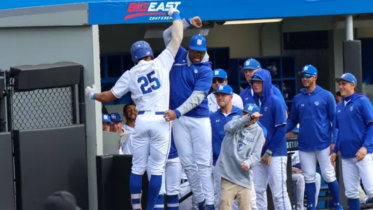 Pirates celebrate after hitting a home run against Georgetown