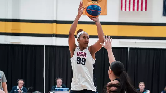 Azana Baines takes a shot during Team USA competition in the summer of 2023.