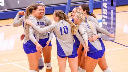Seton Hall volleyball group photo during a match in 2022