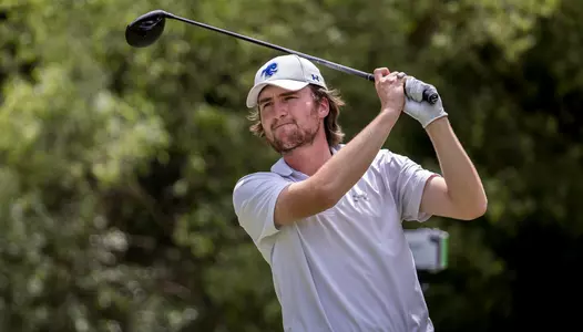 George Fricker tees off during the 2022 BIG EAST Tournament