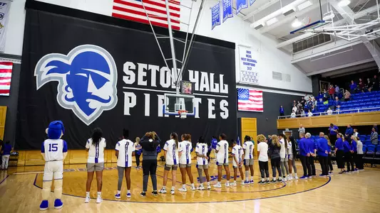 The Seton Hall women's basketball team lines up during the National Anthem during the 2022-23 season.