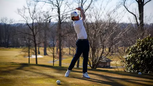 George Fricker takes a swing during photo day in the fall of 2022.