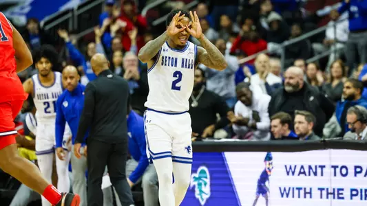 Al-Amir Dawes celebrates after making a three against St. John's