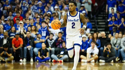 Al-Amir Dawes takes the ball up the floor against Rutgers