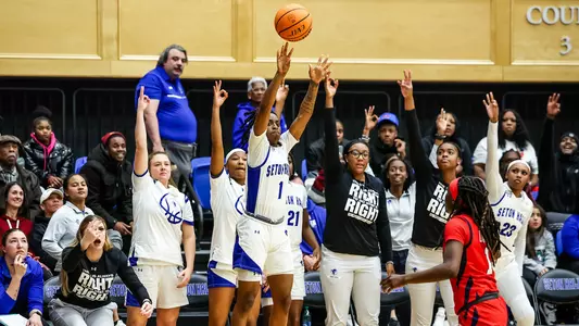 Sha'Lynn Hagans drills a three-pointer with under a minute left in overtime against St. John's.