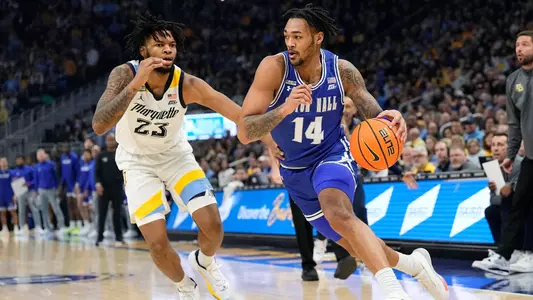 Jan 27, 2024; Milwaukee, Wisconsin, USA; Seton Hall Pirates guard Dre Davis (14) drives for the basket in front of Marquette Golden Eagles forward David Joplin (23) during the first half at Fiserv Forum. Mandatory Credit: Jeff Hanisch-USA TODAY Sports