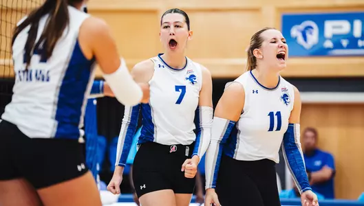 Seton Hall volleyball players Asli Subasili and Maddie Klungel celebrate after a point against DePaul on Oct. 13