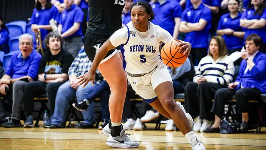 Savannah Catalon drives past a defender against Xavier during the 2023-24 season.
