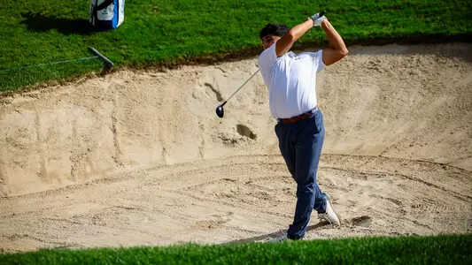 Eli Shah hits from the bunker during a practice round in the fall of 2024
