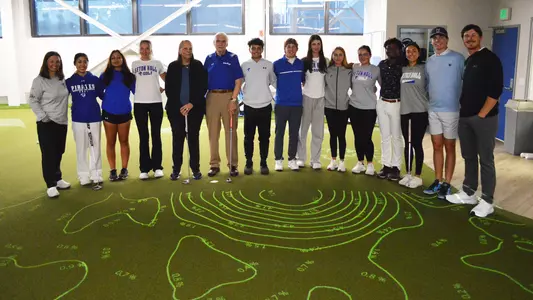 Members of the Seton Hall men's and women's golf teams pose with generous donors Jim and Kathy Leber.